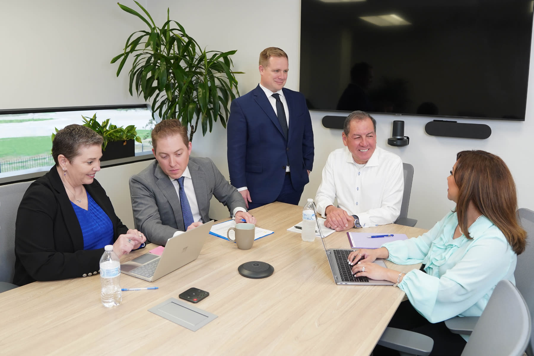 The Navarro team in a client meeting